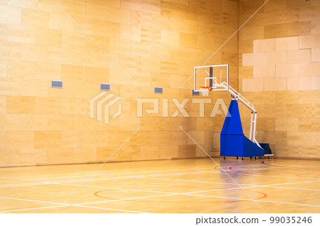 Basketball court with mobile moving basket with copy space Basketball court with mobile moving basket with copy space 99035246