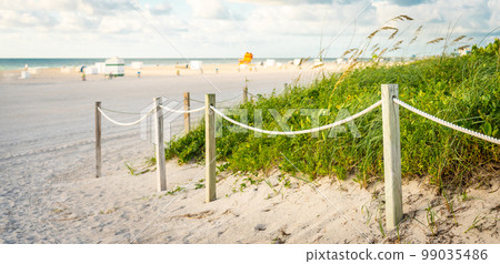 Pathway to the beach in Miami Florida with ocean background 99035486