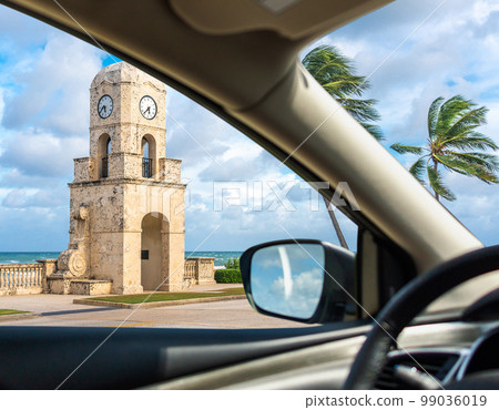 Worth Avenue clock tower in Palm Beach Florida USA, view from a car window 99036019