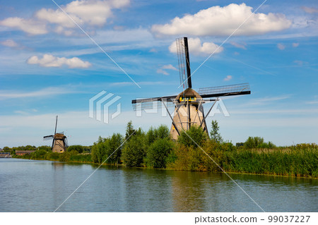 Tranquil view of windmills at Kinderdijk, Netherlands 99037227