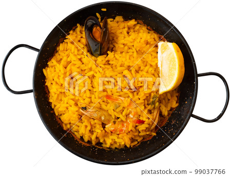 Paella marinera with shrimps and mussels served on iron frypan 99037766