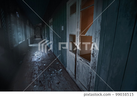 Lost place. Abandoned sanatorium decomposes with time. Broken doors, broken windows. Long corridor. High quality photo 99038515