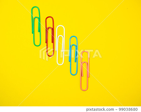 Large multi-colored paper clips. Paperclip of documents. Bright stationery Large multi-colored paper clips. Paperclip of documents. Bright stationery 99038680