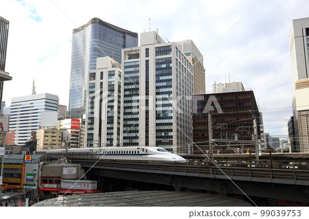 Tokaido Shinkansen running near Yurakucho, Tokyo (November 2018) 99039753