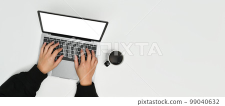 From above view of man hands typing on laptop computer. Panoramic image, copy space for text 99040632