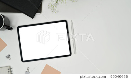 Top view of digital tablet with empty screen, cup of coffee and sticky notes on white table 99040636