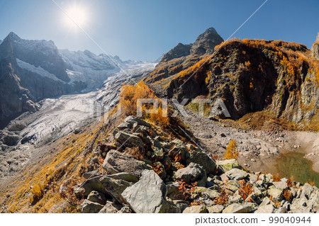 Rocky mountains and glacier. Peak of mountain and glacier in sunny day 99040944