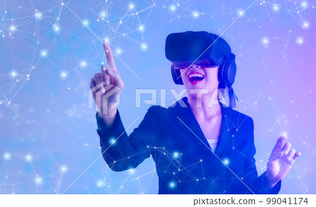 Metaverse technology concept. Asian businesswoman wearing vr headset posed finger touching on hologram. 99041174