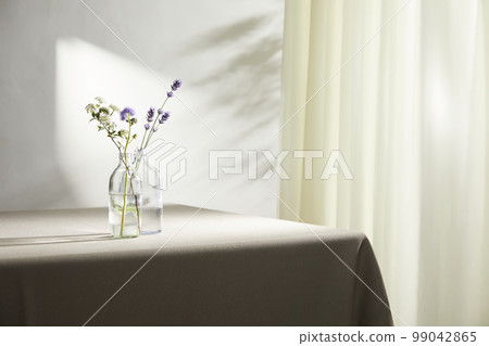 Interior with a beautiful vase in a sunny home 99042865