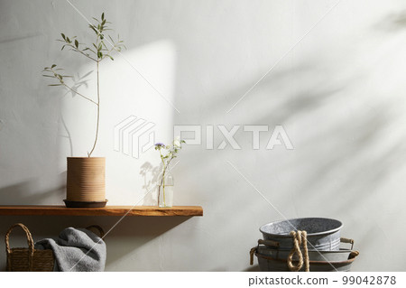 Interior with a beautiful vase in a sunny home 99042878