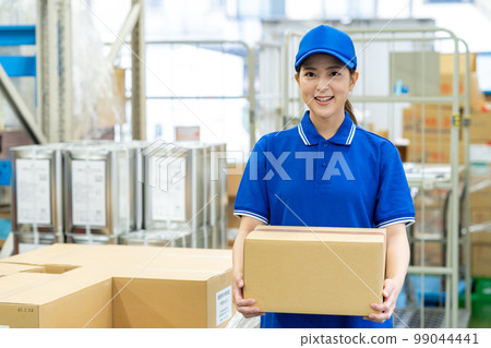 Young woman carrying luggage 99044441