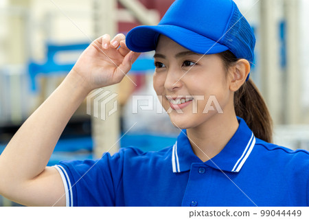 Young woman carrying luggage 99044449