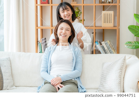 Girl doing shoulder massage Mother's Day Girl doing shoulder massage Mother's Day 99044751