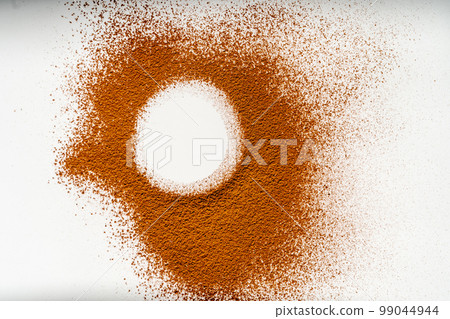 A trace of cocoa, which was sprinkled on something on a white background. A trace of cocoa, which was sprinkled on something on a white background. 99044944