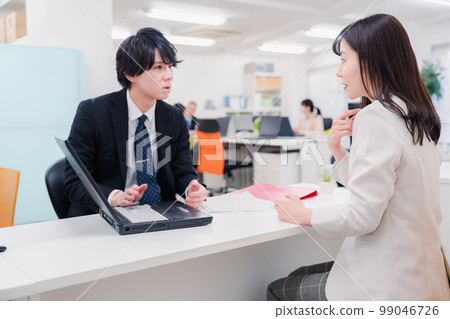 Male staff at the counter 99046726