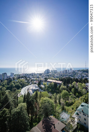View of the sea and the houses of the city of Sochi. 99047315