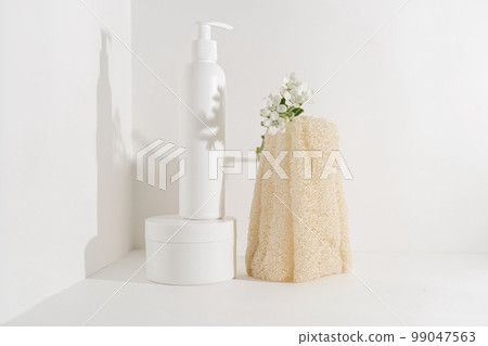 Serum and natural sponges on a light background. 99047563