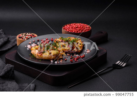Meat baked in the oven with pineapple, tomatoes, cheese, spices and herbs Meat baked in the oven with pineapple, tomatoes, cheese, spices and herbs 99047755