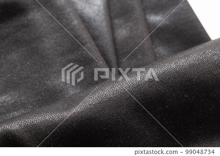 Black fabric with a beautiful shade, macro. Fashion 99048734