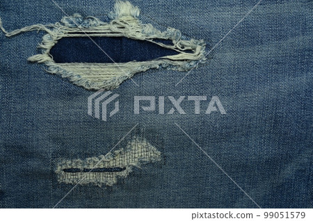 torn on denim jean textile 99051579