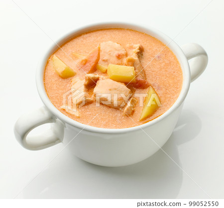 bowl of salmon and tomato soup 99052550