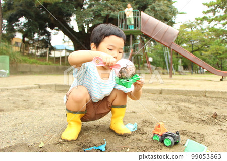 Children playing in the sandbox Children playing in the sandbox 99053863