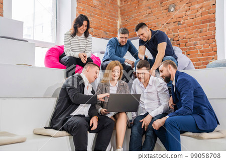 a group of men and women in coworking. the concept of teamwork. 99058708