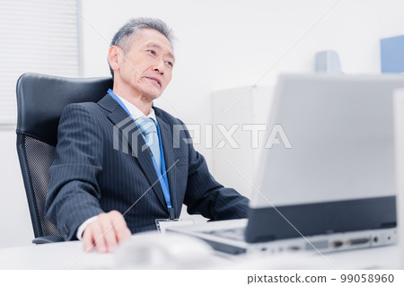 A man in a managerial position who speaks his opinion in the company A man in a managerial position who speaks his opinion in the company 99058960