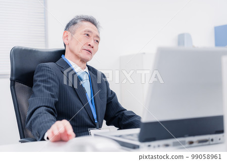 A man in a managerial position who speaks his opinion in the company A man in a managerial position who speaks his opinion in the company 99058961