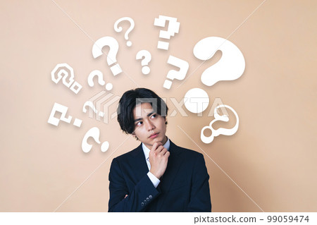 Young businessman with doubt 99059474