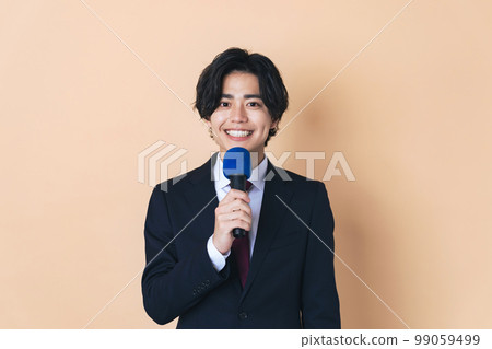 A man who speaks with a microphone A man who speaks with a microphone 99059499