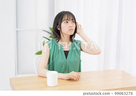 young woman listening 99063278