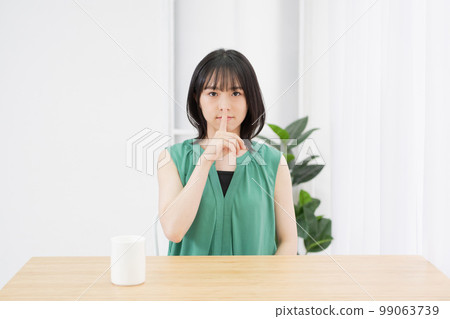Young woman doing a secret pose in the living room Young woman doing a secret pose in the living room 99063739