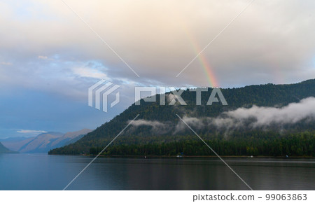 Landscape with a rainbow in the sky over Teletskoye lake 99063863