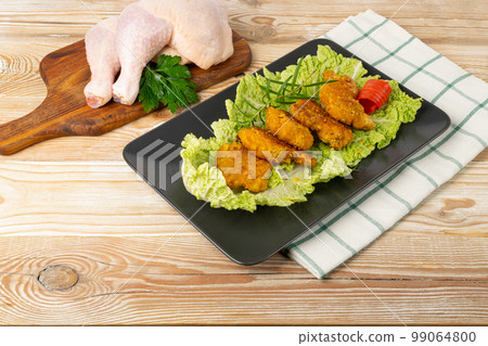 Chicken Strips, Breaded Nuggets on Lettuce, Crispy Fry Chicken Meat with Greens, Crunchy Fillet Pieces Chicken Strips, Breaded Nuggets on Lettuce, Crispy Fry Chicken Meat with Greens, Crunchy Fillet Pieces 99064800