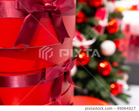 Decorated Christmas Tree, Christmas Decorations, Shiny Garland on Green Branches, Blurred Background 99064827