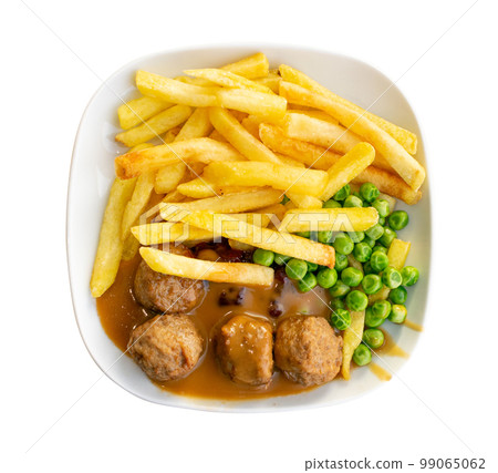 Meatballs with French Fries, Green Peas, Bechamel Sauce on White Plate Meatballs with French Fries, Green Peas, Bechamel Sauce on White Plate 99065062