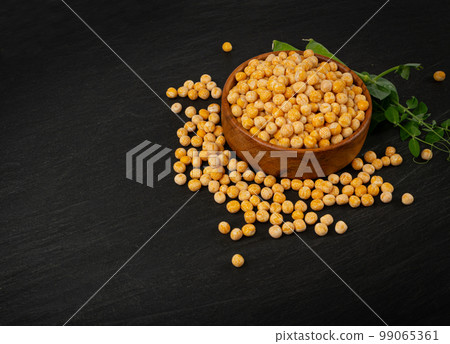 Dry Scattered Yellow Peas on Black Background, Whole Pea Pile, Raw Legume, Protein Source, Healthy Vegan Food Dry Scattered Yellow Peas on Black Background, Whole Pea Pile, Raw Legume, Protein Source, Healthy Vegan Food 99065361
