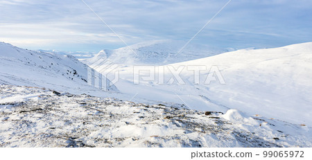Scenic view of the snow covered landscape of the Dovre mountains in Norway at winter 99065972