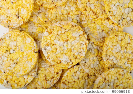 Puffed Corn Cake Texture Background, Corn Diet Bread with Fragrant Herbs and Spices, Waffle with Corns Pattern 99066918