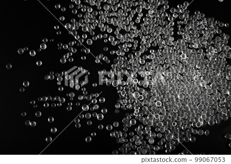 Desiccant Silica Gel Adsorbent Crystals on Black Background, Desiccant Polymer Balls Desiccant Silica Gel Adsorbent Crystals on Black Background, Desiccant Polymer Balls 99067053
