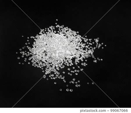 Desiccant Silica Gel Adsorbent Crystals on Black Background, Desiccant Polymer Balls Desiccant Silica Gel Adsorbent Crystals on Black Background, Desiccant Polymer Balls 99067066