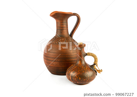 Ceramic amphora and small jug isolated on white background. 99067227