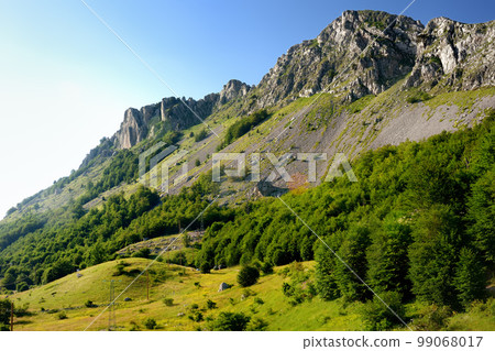 Scenic landscape of mountain valley in european Alps. Stunning view of mountains and valleys in sunset light Scenic landscape of mountain valley in european Alps. Stunning view of mountains and valleys in sunset light 99068017