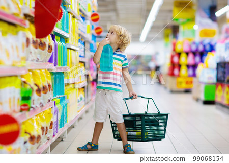 Child in supermarket. Kid grocery shopping. Child in supermarket. Kid grocery shopping. 99068154