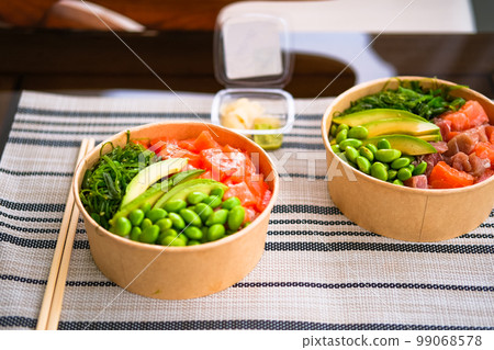 Frash raw appetizing poke bowl with salmon, avocado, rice. 99068578