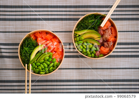 Frash raw appetizing poke bowl with salmon, avocado, rice. 99068579