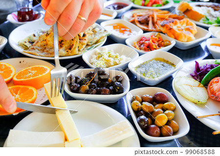 Traditional Turkish breakfast. Plates with various appetizers. 99068588