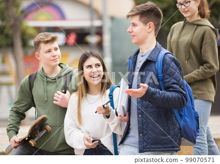 Teenage students talking outside after lessons 99070571