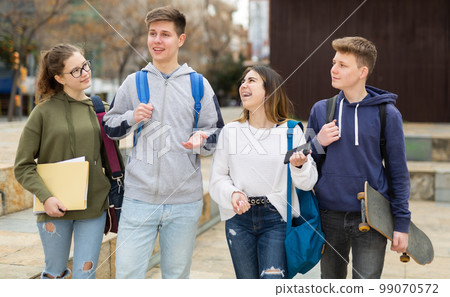 Teenage students talking outside after lessons 99070572